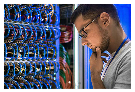 Technician pondering a patch panel configuration