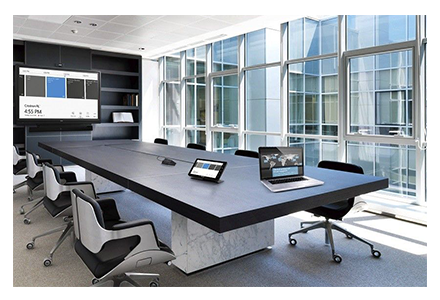 Conferencing room with a table and a TV